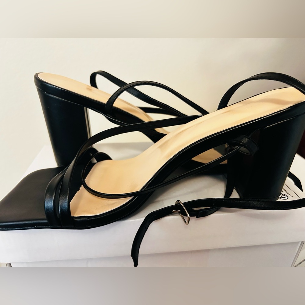 All black heels. Wraps around ankle. Size 10. Been wore once.